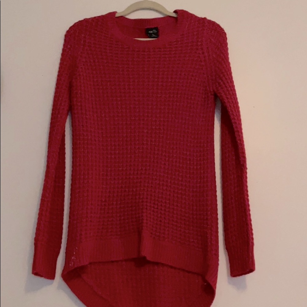 Red knitted sweater.
